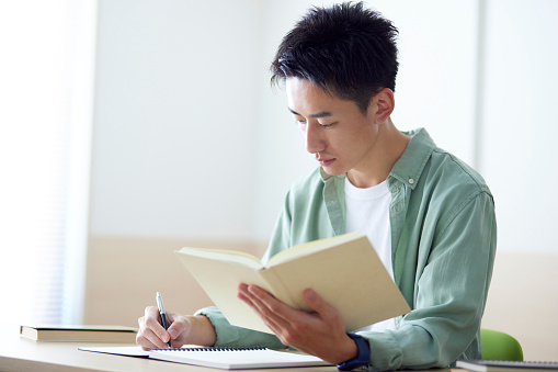 Young Japanese student studying in the classroom