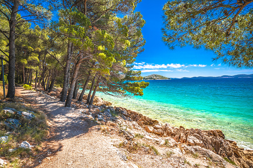Idyllic turquoise rocky beach landscape view in Zadar riviera, Pakostane in Dalmatia region of Croatia