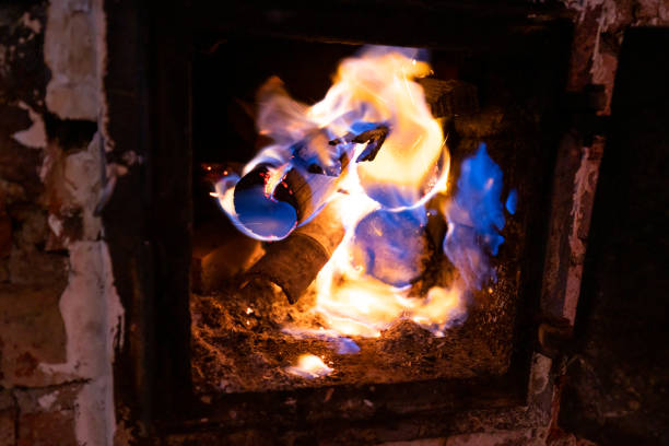 Light a firewood in the dark. orange flame