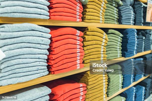 Plenty Of Sweatshirts In Different Colors On The Shelf Stock Photo - Download Image Now