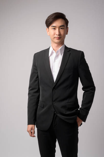 istock Young businessman wearing  suit over white background studio 1431852726
