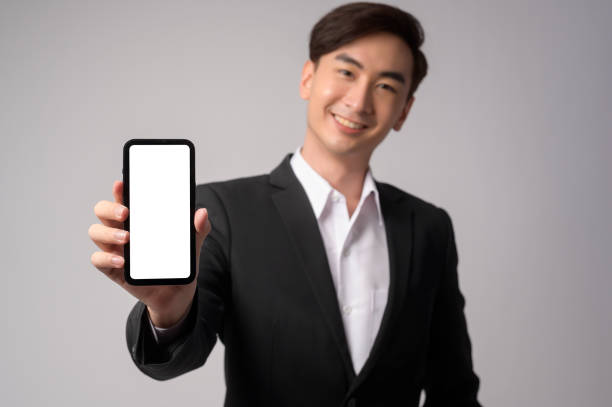 istock Young businessman wearing  suit over white background studio 1431852842