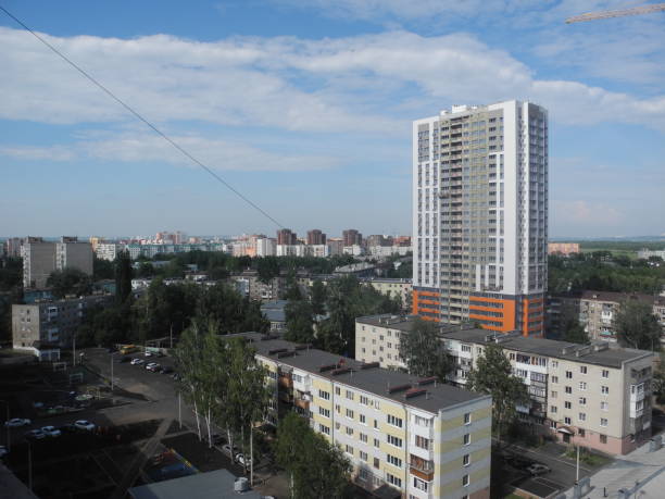 istock Crane and building under construction against blue sky 1431856674