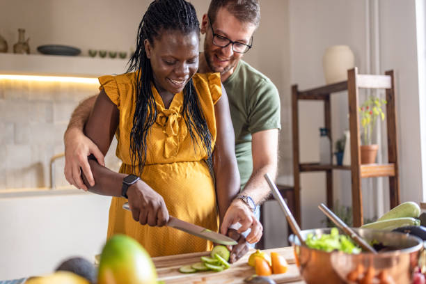 istock Couple cooking together at home 1431858315