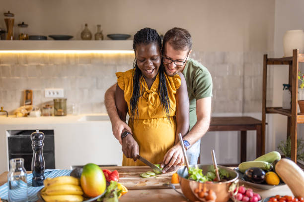 istock Couple cooking together at home 1431858863