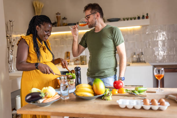 istock Multi ethic couple cooking together at home 1431858984