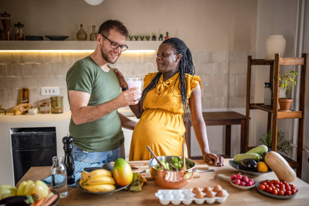 istock Pregnant couple takes prenatal supplements 1431859265