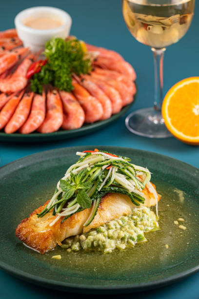 istock spanish seafood paella, Various protein sources concept - rib eye, dorado, pork, egg. 1431859326