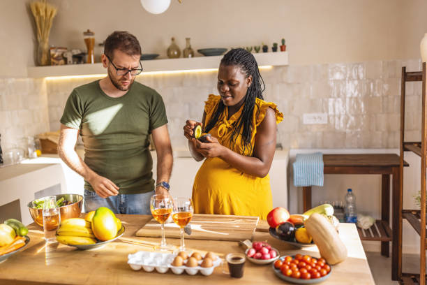 istock Happy multi ethnic couple cooking together at home 1431859381