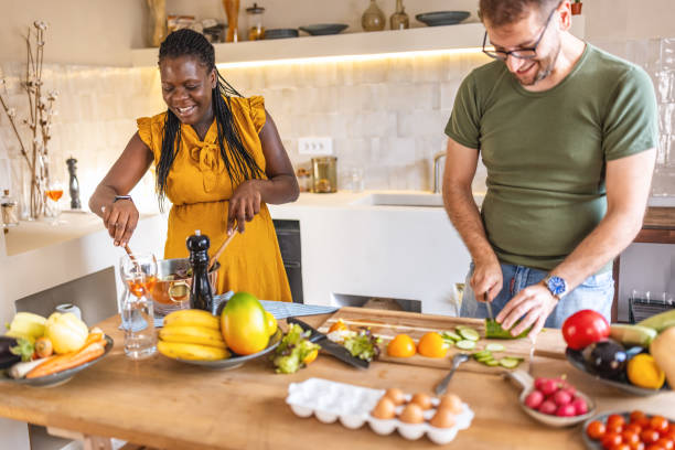 istock Future parents in the kitchen while preparing a salad for lunch 1431860142