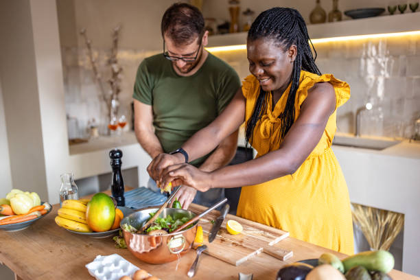 istock Couple cooking together at home 1431860299