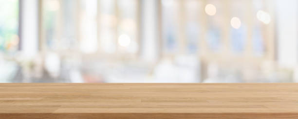 istock Empty wood table top and blurred coffee shop, cafe and restaurant interior background - can used for display or montage your products. 1431860648