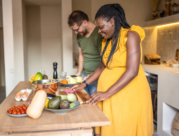istock Multi ethic couple cooking together at home 1431860690