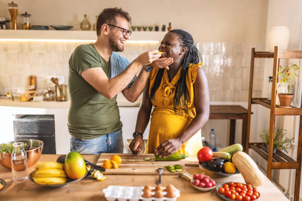istock Couple cooking together at home 1431861465