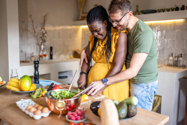 istock Multi ethnic couple cooking together at home 1431862223