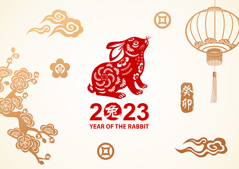 Celebrate the Year of the Rabbit 2023 with rabbit Chinese painting on the background of gold colored Chinese stamp, cloud, lantern, flowers and money sign, the red Chinese stamp means rabbit and the vertical Chinese phrase means year of the rabbit according to lunar calendar system