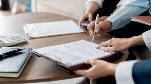 istock Real Estate Agent explain insurance and sign contract agreement contract to client. 1431876370