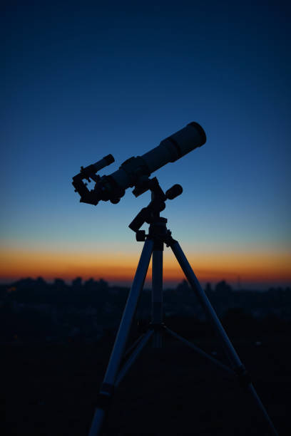 istock Astronomical telescope under a twilight sky ready for stargazing. 1431878499