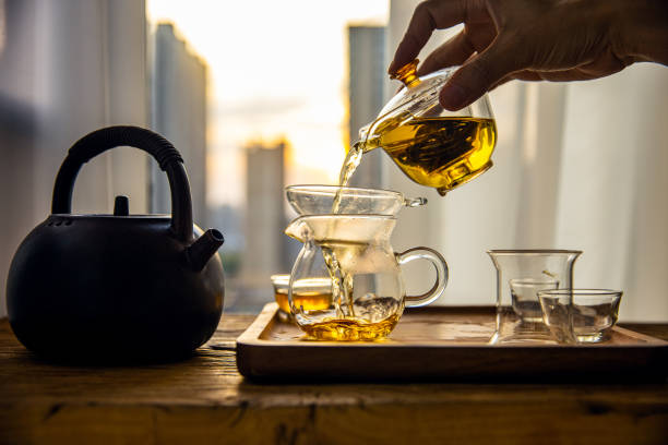 istock Hand pouring Chinese tea into glass cup 1431883706