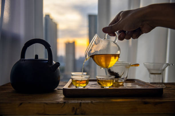istock Hand pouring Chinese tea into glass cup 1431884214