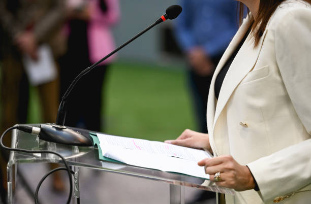 Woman delivering speech at public event