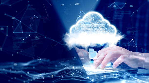 istock A person is connecting to the Internet through a notebook computer to upload and download data to cloud technology or edge computing. abstract white cloud polygon binary code on dark blue background. 1431894963