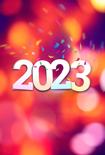 New Year 2023 with confetti on colorful background