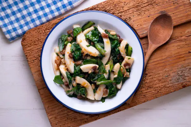 Cuttlefish cooked with chard and spinach. Spanish traditional tapas.
