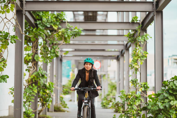 istock Woman in office attire riding towards work. 1431903749