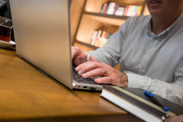 istock business person is typing with laptop focus on foreground 1431904767