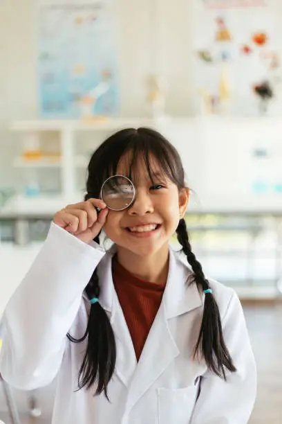 Photo of Young Girl Goofing Around In Science Class