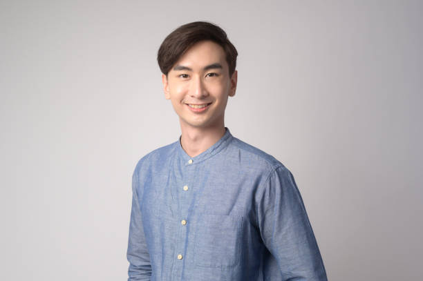 istock Portrait of young asian man over white background studio. 1431905054
