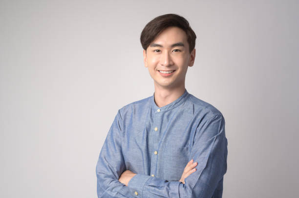 istock Portrait of young asian man over white background studio. 1431905164