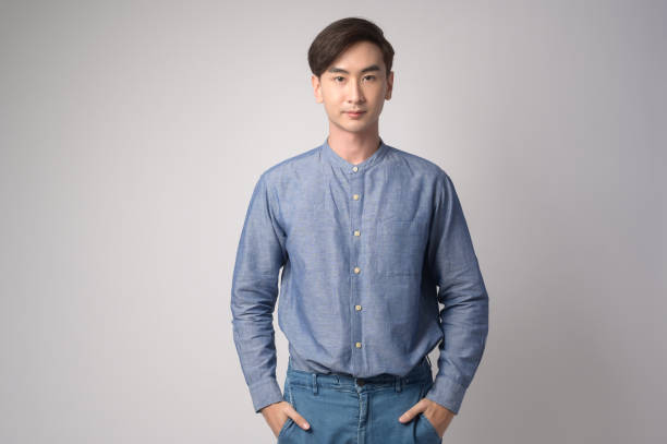 istock Portrait of young asian man over white background studio. 1431905288