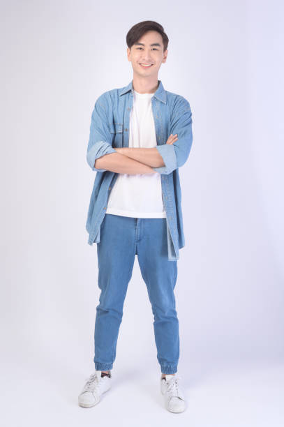 istock Portrait of young asian man over white background studio. 1431905337