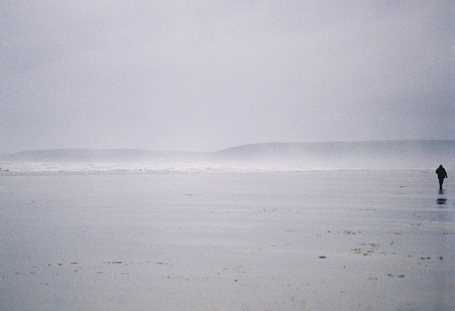 Hazy winter walk on Devon beach at Westward Ho!, 35mm film.