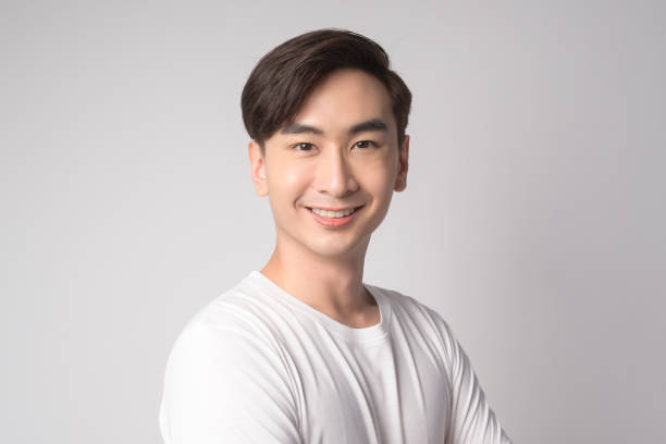 istock Portrait of young asian man over white background studio. 1431906124