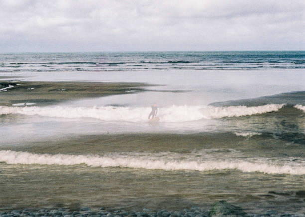 istock Surfer and sunny beach 35mm double exposure 1431906185