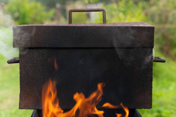istock A rusty metal smokehouse stands on a fire 1431908601