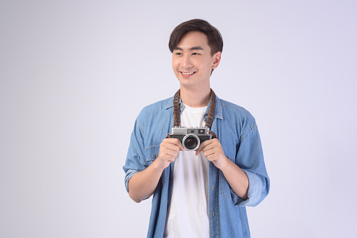 Asian man wearing sunglasses on background,Portrait of handsome young asian man wearing sunglasses, summer vacation concept