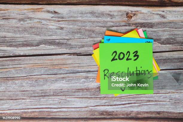 New Year 2023 Goals Resolutions And Bucket List Concept Colorful Sticky Notes On Wood Background Stock Photo - Download Image Now