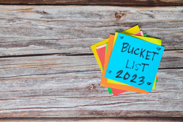 New year 2023 goals, resolutions and bucket list concept. Colorful sticky notes on wood background. New year 2023 goals, resolutions and bucket list concept. Colorful sticky notes on wood background. vision board 2023 stock pictures, royalty-free photos & images