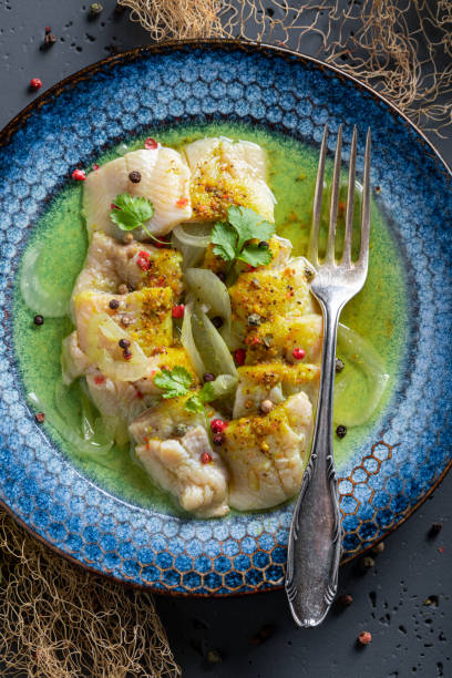 istock Tasty marinated herring in oil with onions and pepper. 1431909381