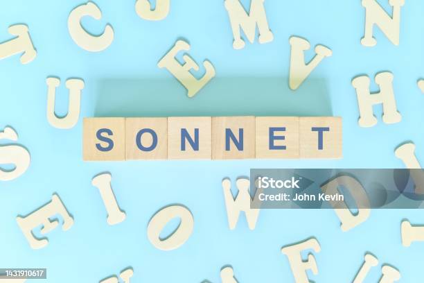 Sonnet Poetry Narrative Form In English Literature Concept Wooden Blocks Typography Word Flat Lay In Blue Background Stock Photo - Download Image Now