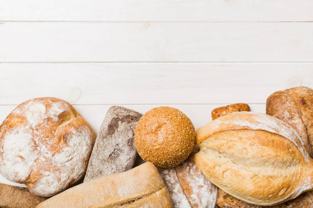 istock Homemade natural breads. Different kinds of fresh bread as background, top view with copy space 1431912544