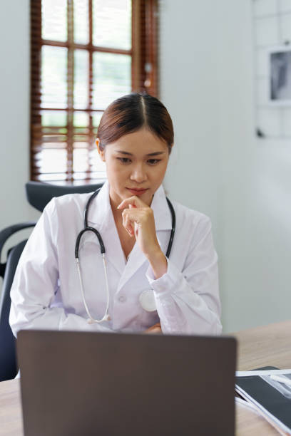 istock Portrait of an Asian doctor using a computer 1431913466