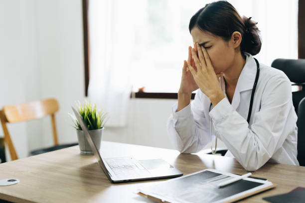 istock An Asian female doctor uses a computer while showing concern about patient information 1431913626