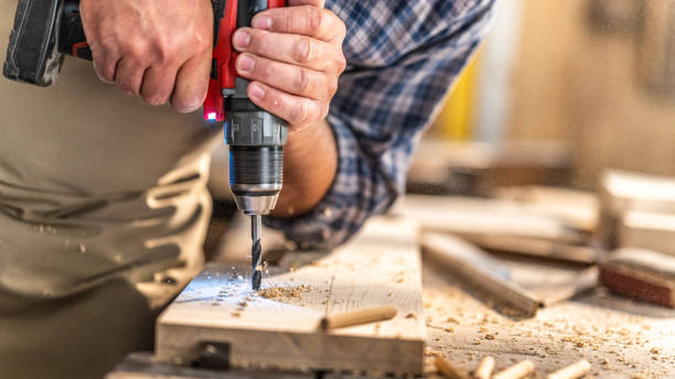 istock Drilling holes in wooden plank 1431914106
