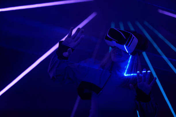 istock Woman is using virtual reality headset to access in metaverse. 1431914436