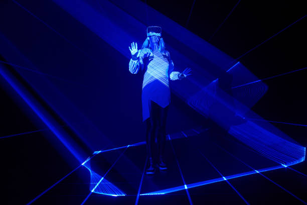 istock Woman is using virtual reality headset to access in metaverse. 1431914496